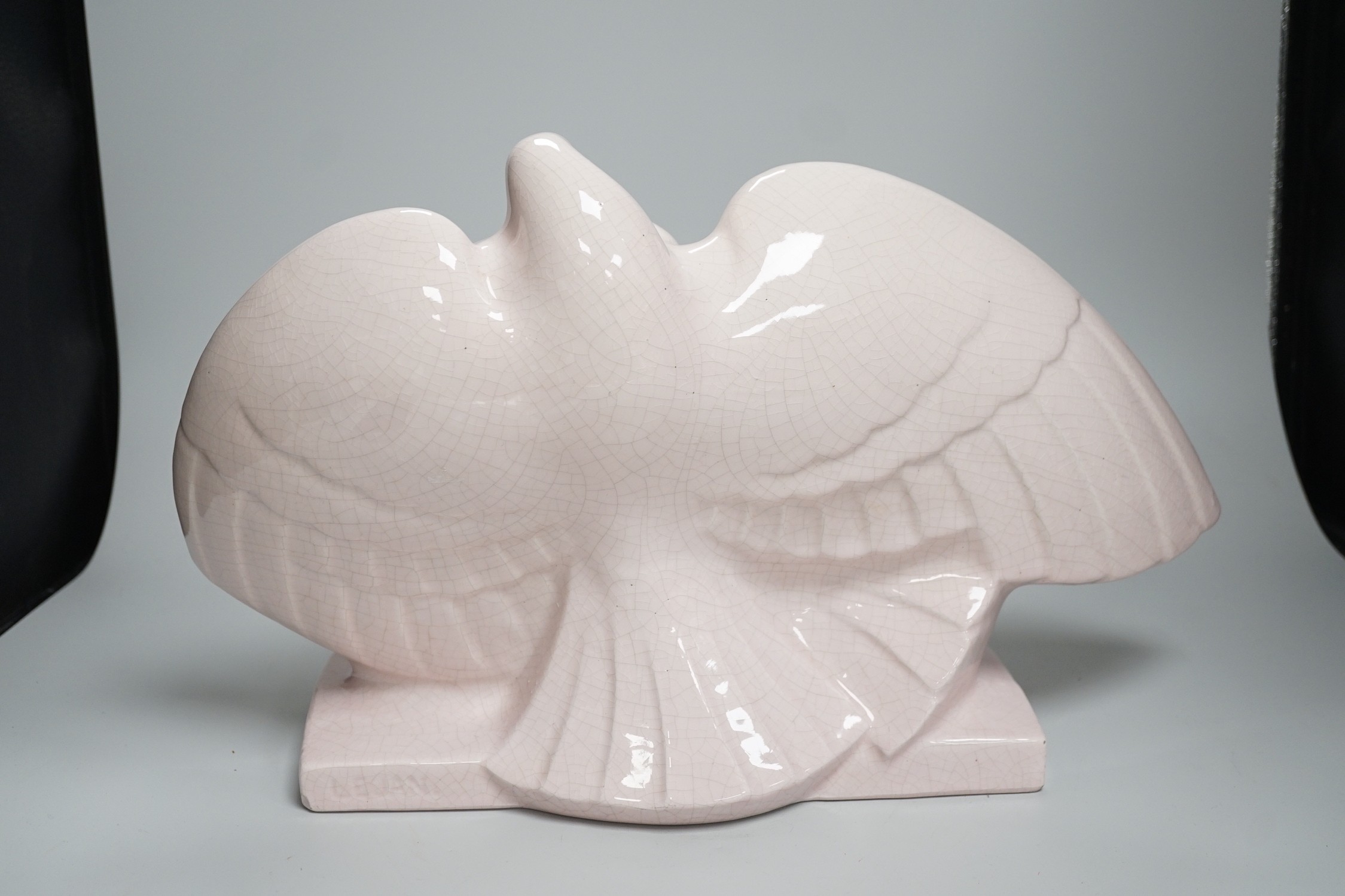 A French Art Deco Lejan pink crackleware model of a pair of doves, 26cms high x 45cms wide